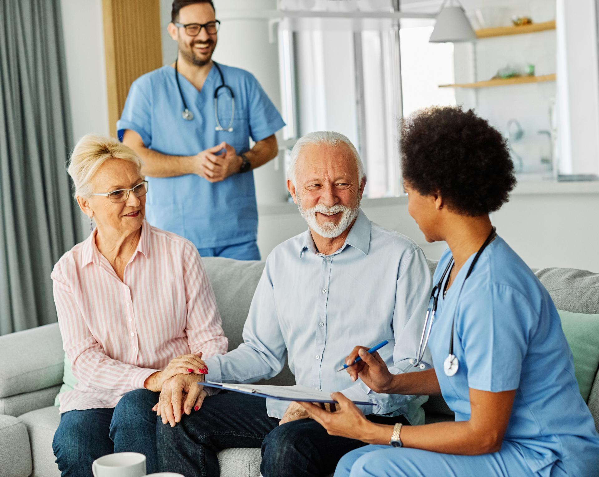 nurse doctor senior couple care caregiver help assistence retirement home nursing elderly man woman insurance clinic